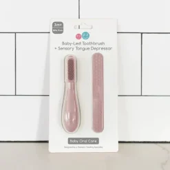 ezpz Oral & Nasal Care*- Baby-Led™ Toothbrush + Sensory Tongue Depressor Dual Pack, Blush