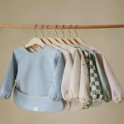 Mushie Baby Coats, Sweaters & Jackets*- Long Sleeve Baby Bib, Waterproof Fabric, Adjustable Fit for Ages 6-24 Months, Tradewinds