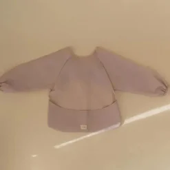 Mushie Baby Coats, Sweaters & Jackets*- Long Sleeve Baby Bib, Waterproof Fabric, Adjustable Fit for Ages 6-24 Months, Blush